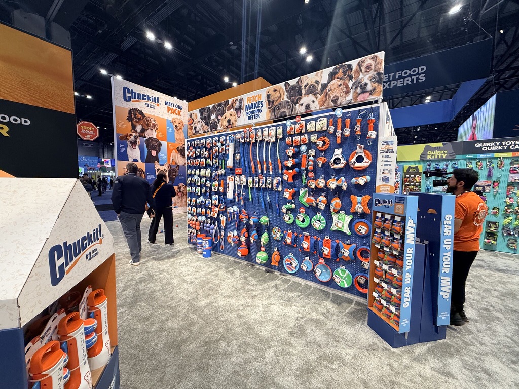 Petmate Chuckit toy display with photos of Dallas dog model faces above it.